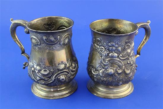 Two similar late George II silver baluster mugs, 20 oz.